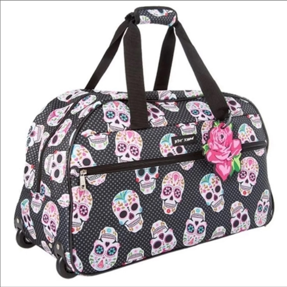 BETSEY JOHNSON “SKULL PARTY” ROLLIN SUITCASE.